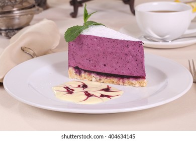 Blueberry Cheesecake And Tea With Lemon And Sugar
