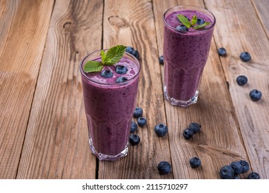 Blueberry Cocktail (smothie) In A Glass On A Rustic Wooden Background. 