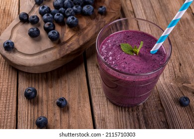 Blueberry Cocktail (smothie) In A Glass On A Rustic Wooden Background. 