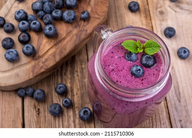 Blueberry Cocktail (smothie) In A Glass On A Rustic Wooden Background. 