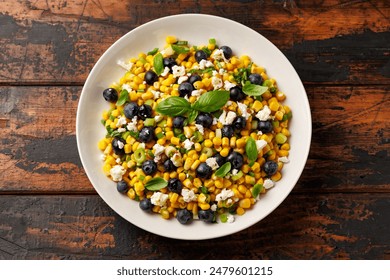 Blueberry Corn Feta Salad in white plate on wooden table. Healthy food. - Powered by Shutterstock