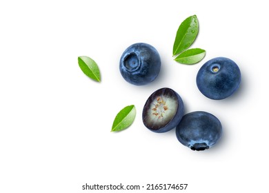 Blueberry fruit with green leaves isolated on white background. Top view. Flat lay.