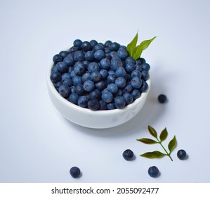 Blueberry Fruit Inside A White Bowl On A White Background,close-up