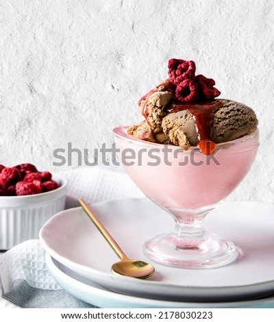 Blueberry ice cream, fruity, chocolate and blackberry ice cream in a pine bowl, fruit dessert.