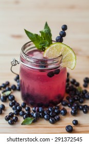 Blueberry mojito on a wooden desk