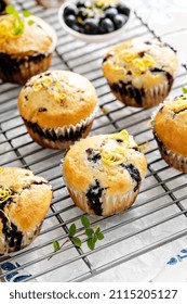 Blueberry Muffins With Fresh Berries And Blueberry Preserves On A Cooling Rack