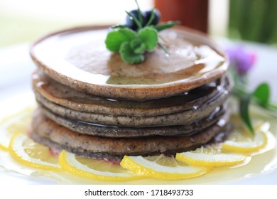 Blueberry Pancakes And Sliced Lemon.