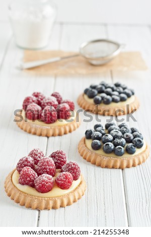 Similar – Image, Stock Photo Delicious strawberry tartlets with vanilla cream in heart shape