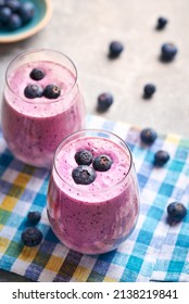 Blueberry Smoothie In Glass. Homemade Blueberry Smoothie On Rustic Wooden Table. Blueberry Smoothie With Yogurt And Oats.