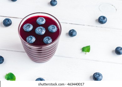 Blueberry Smoothie On Wooden White Background, Top View