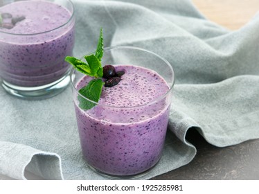 Blueberry Smoothie Topped With Blueberries. A Glass Of Breakfast Smoothie Drink Made From Pureed Raw  Blueberries, Banana, Milk, Yogurt, And Cottage Cheese. 