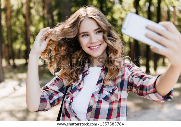Blueeyed Shy Girl Using Phone Selfie Stock Photo Edit Now 1357585784