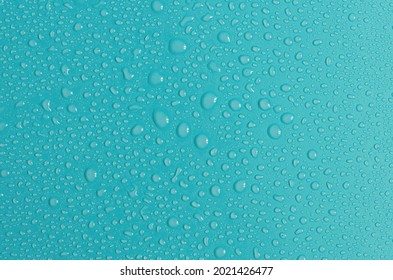 Blue-green background with large and small water drops. The texture of a water drop on a colored background is a top view. - Powered by Shutterstock