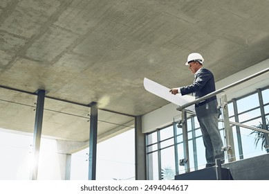 Blueprint, architect and man reading at construction site for office renovation, development and maintenance. Floor plan, engineer and person with design document for building project or remodeling - Powered by Shutterstock