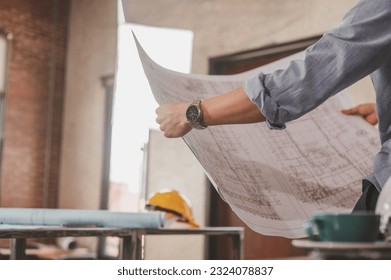 blueprint, plan, architect, project, engineer, meeting, brainstorming, teamwork, team, paperwork. engineer look at blueprint to checking architecture and structure for building constructor project.