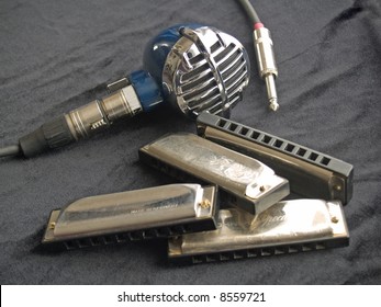 Blues harmonicas and a vintage microphone