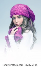 Blue-toned Picture Of Beautiful Woman In Winter Hat