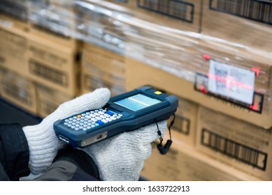 Bluetooth barcode scanner checking goods in the cold room or warehouse.