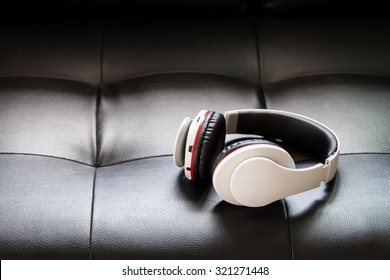 Bluetooth Headphones On Black Leather Background