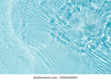 Bluewater waves on the surface ripples blurred. Defocus blurred transparent blue colored clear calm water surface texture with splash and bubbles. Water waves with shining pattern texture background. - Powered by Shutterstock