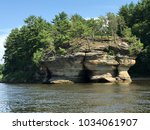 Bluffs along the Wisconsin river into Lake Delton.  This rock formation with trees atop form a island