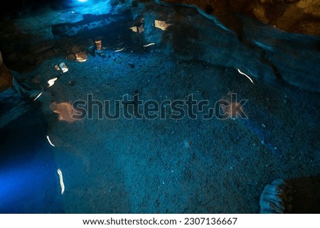 bluish waters of the lake inside a cave