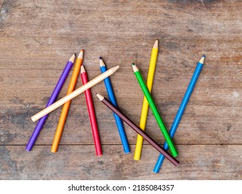 Blunt Coloured Pencils On Wood Floor.