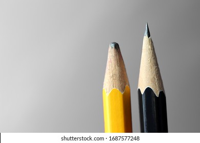 blunt yellow pencil and sharp black pencil