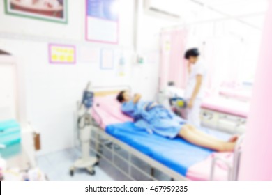 Blur ,A Pregnant Woman Lying In Bed Waiting For The Birth,Monitor Fetal Heart Sound ,on Oxygen Mask With Bag,IV Patient,