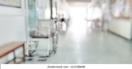 Blur abstract background of corridor in clean hospital with patient wheelchair Blurry  wheel chair for World Disability Day.