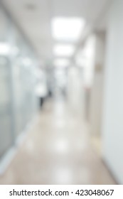  Blur Abstract Background Of Corridor In Clean Hospital. Blurry View Of Aisle In Office With Light Floor. Defocus Walkway In White Light Building Hall.