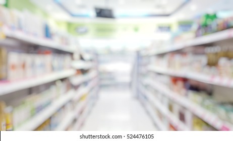Blur abstract background drugstore with customers. Blurry view of drug store and pharmacist. Blurred clean pharmacy with medicine on shelves. Defocus white drugstore.