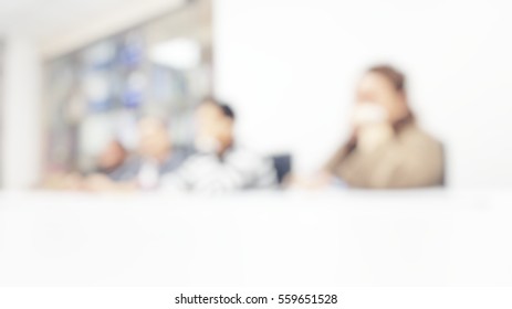 Blur Abstract Background Of Employees Meeting In Conference Room.Blurry Defocused View Of Colleagues On All Hand Meeting White Table In Office Work Place.International Day Of Cooperatives.