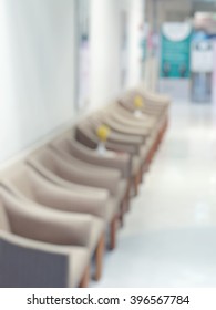 Blur abstract background of empty chairs in waitng zone of hospital