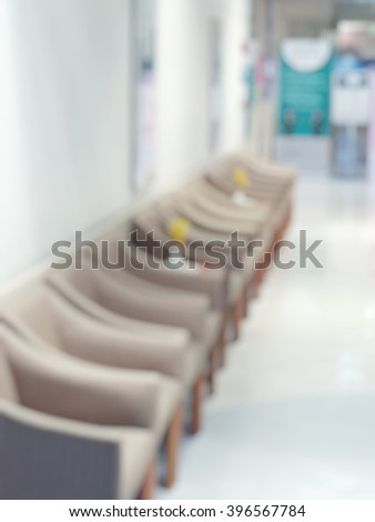 Blur abstract background of empty chairs in waitng zone of hospital