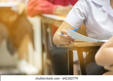 Blur abstract background of examination room with undergraduate students inside. student sitting on row chair doing final exam in classroom. - Shutterstock ID 642182779