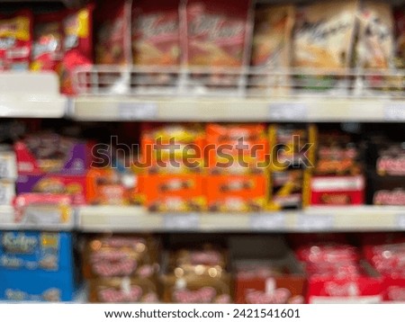 Blur abstract background of people shopping in super market, products on shelves, Supermarket with bokeh, defocus customers, vintage colors