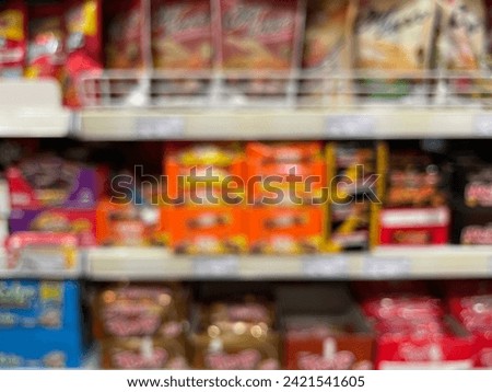 Blur abstract background of people shopping in super market, products on shelves, Supermarket with bokeh, defocus customers, vintage colors