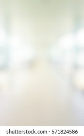 Blur Abstract Background Perspective View Of Aisle Bridge In Hospital Building Defocused Light Hallway Interior Corridor In Clean Clinic. Blurry View Of Outdoor  Walkway In Office Work Place