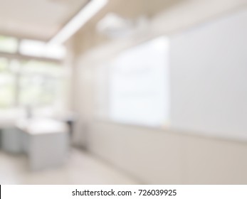 Blur Abstract Background Of Smart Classroom With Whiteboard.. Blurred Image Of Empty Elementary Room. Blurry View Of Primary Class Without Student