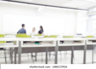 Blur Abstract Background Teacher In Front Of Classroom For Meet The Parent Day. Blurry Instructor Teaching In School. Defocus Open House Day At Campus For Kindergarten Students.American Education Week