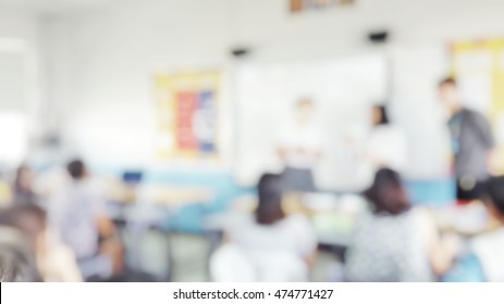 Blur abstract background teacher in front of classroom for meet the parent day. Blurry instructor teaching in school. Defocus open house day at campus for kindergarten students.American Education Week