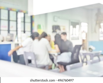 Blur Abstract Background Teacher With Parent In Classroom For Parent Teacher Conference Day. Blurry Teachers With Translators Meet Parents In International School. 