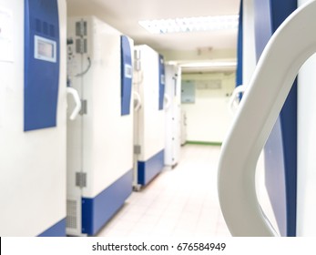 Blur Abstract Background Of Ultra Low Temperature Freezer For Specimens Storage In Laboratory Testing In Medical Hospital.Blurry View Rows Of Refrigerators For Lab Research In University