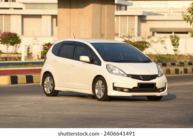 Blur abstract background of a white hatchback car