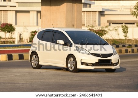 Blur abstract background of a white hatchback car