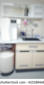 Blur Abstract Background White Microbiology Laboratory Cleaning Workstation Office For Research Or Education.Blurry View Of Empty Modern White Medical Or Chemical Lab For Safety At Work.