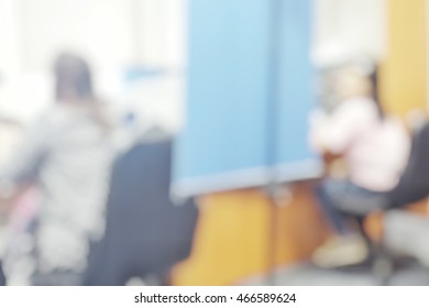 Blur Abstract Background Workers Apply To Make ID Card With Blue Screen Behind. Blurry View Citizens Taking Photo At Office. Defocus Civil Registration And Identification Card Section.