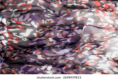 Blur: An abstract leopard print pattern in shades of red, purple, black, and white on delicate, semi-transparent fabric. The textured layers create a flowing, vibrant appearance with a soft sheen.