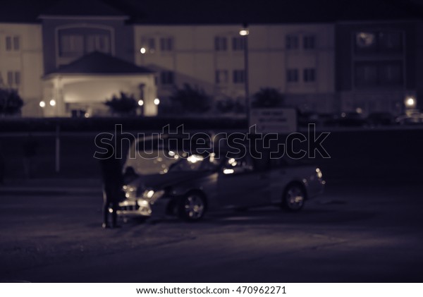 Blur\
abstract motion of car accident at blue hour with bokeh light in\
background. Car crash on street at Houston, Texas, US. City traffic\
accident, car collision, auto insurance\
concept.
